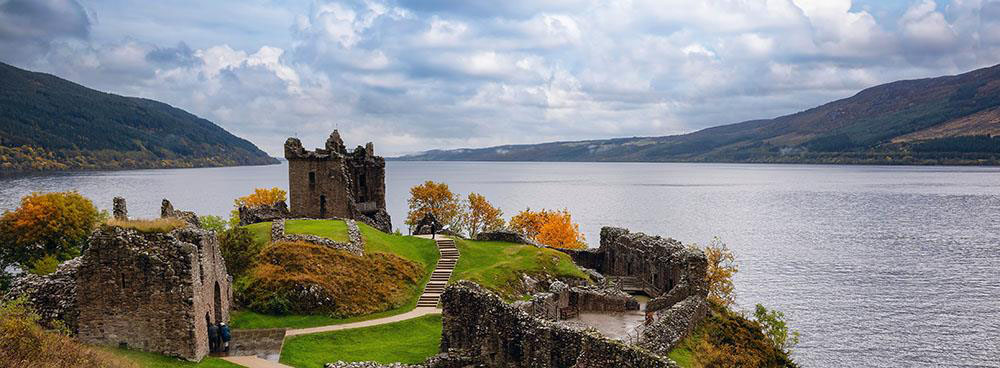 Urquhart Castle in the enchanting colors of autumn, a historical gem on the shores of Loch Ness, Scotland.