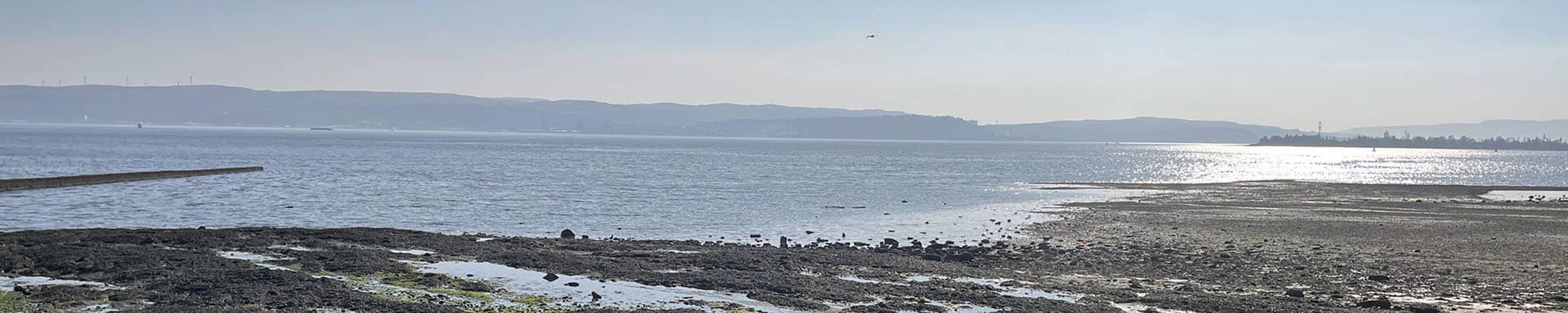 A picturesque image of Helensburgh coastline on a bright sunny day.