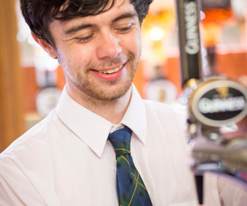 Lochs & Glens Bar Tender pouring a pint at one of our highland loch hotels