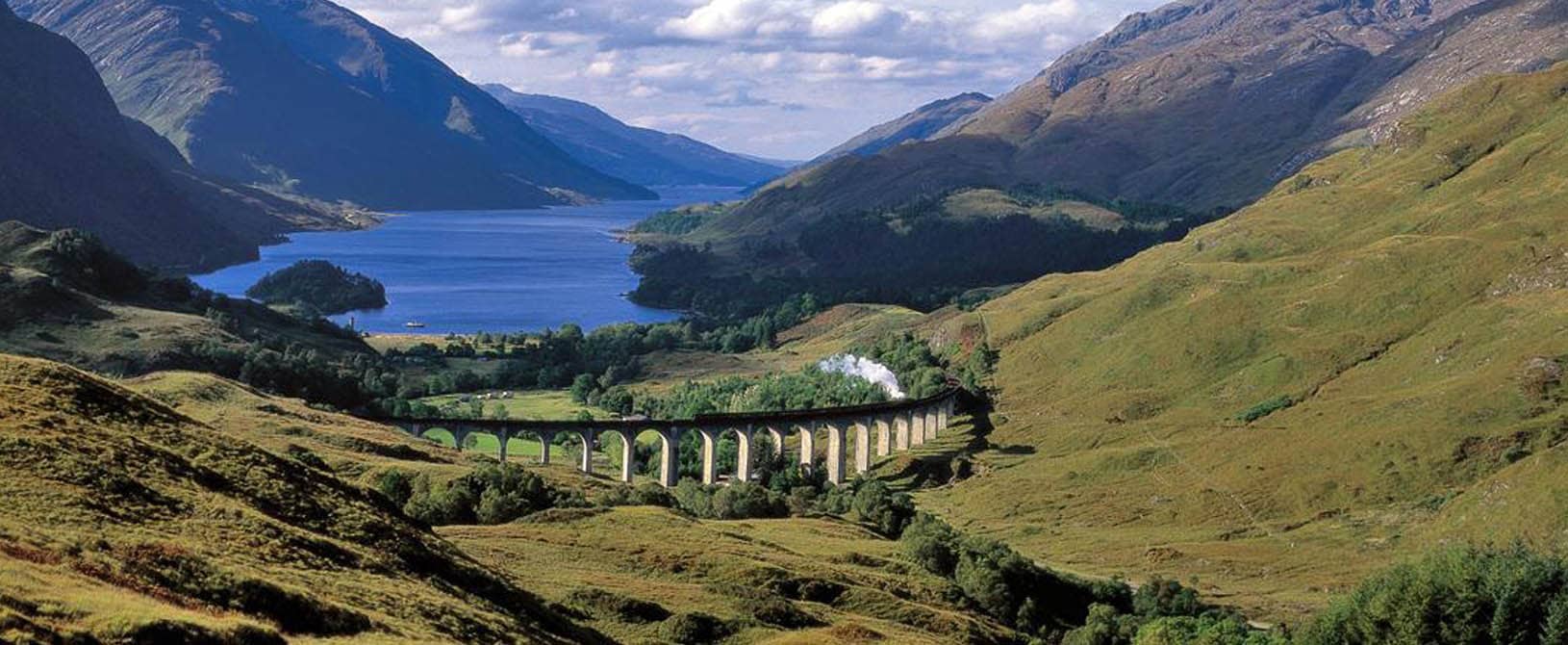 A favourite of Lochs and Glens excusrions the Jacobite steam train crossing the Glenfinnan Viaduct