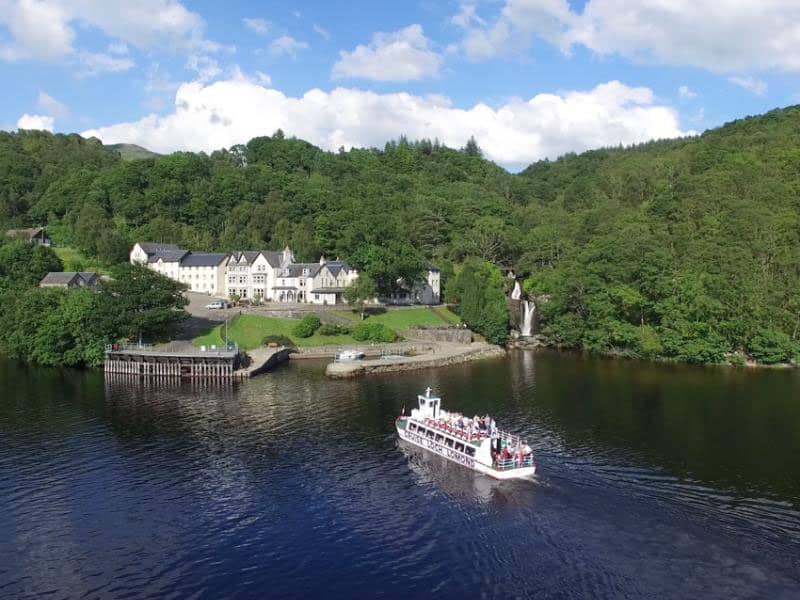 The cruise Loch Lomond Ferry crossing the Loch to the Inversnaid Hotel