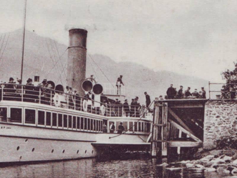 Vintage photograph of the Sir Walter Scott steam boat docked at the Inversnaid Hotel pier.