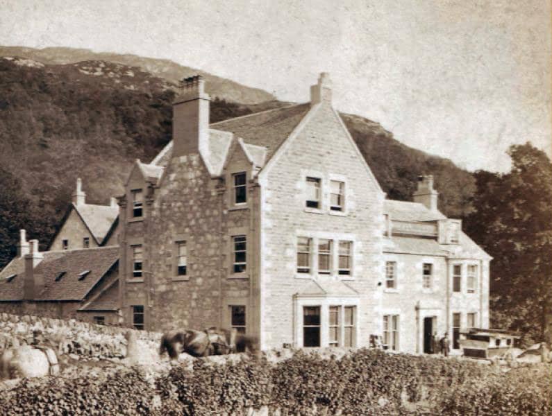 Historic photo of the garrison at Inversnaid with stone buildings