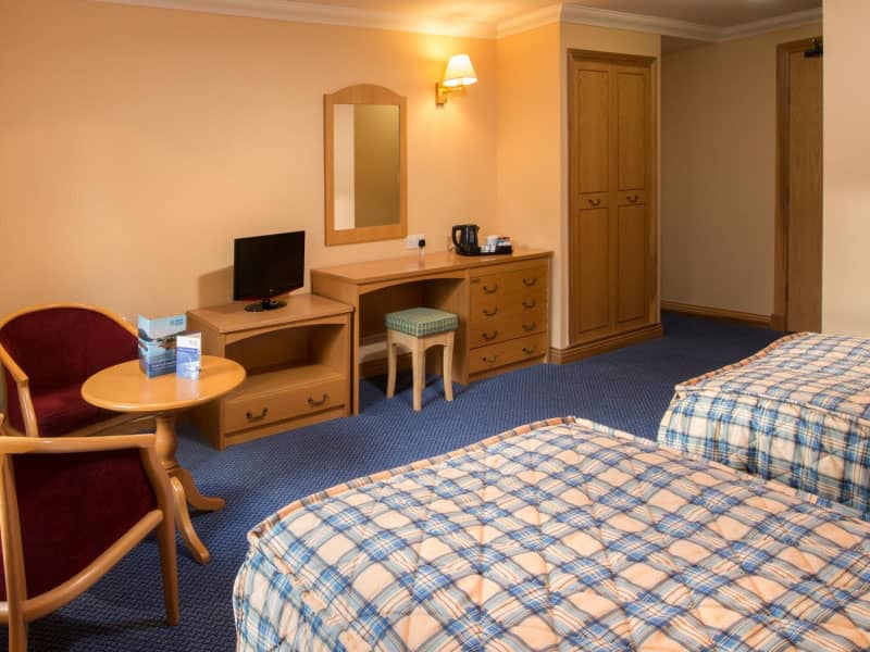 Spacious twin room at the Loch Tummel Hotel with modern amenities and comfortable furnishings