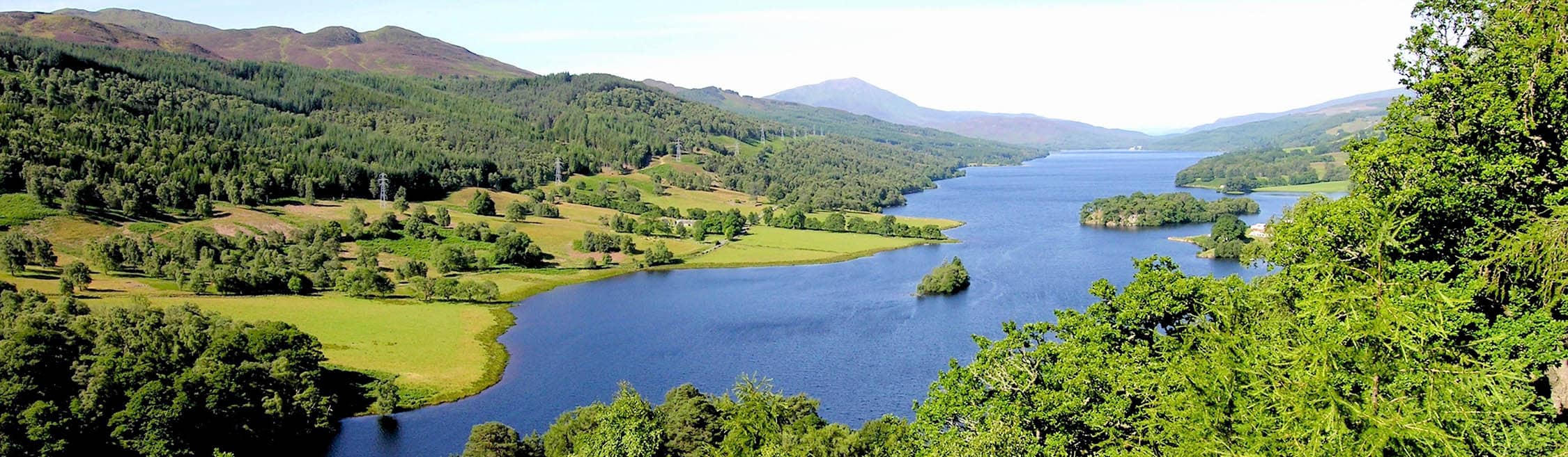 Panoramic view from Queen's View overlooking Loch Tummel and surrounding hills