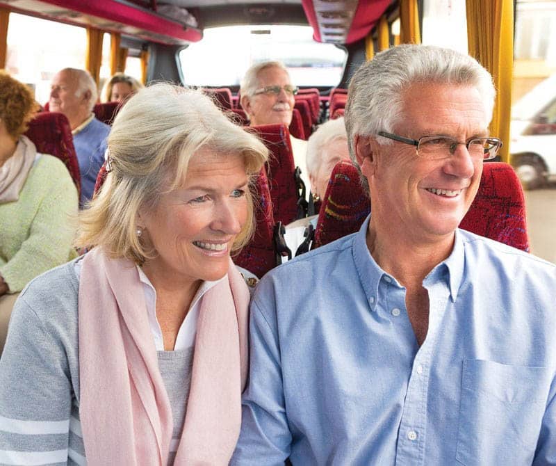 Customer's on a Lochs and Glens Coach tour looking out the coach window