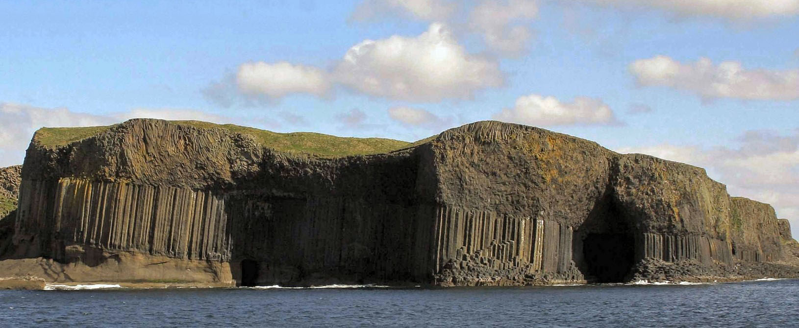 Views of the island of Staffa from aboard a local boat crossing from Fionnphort on the Isle of Mull